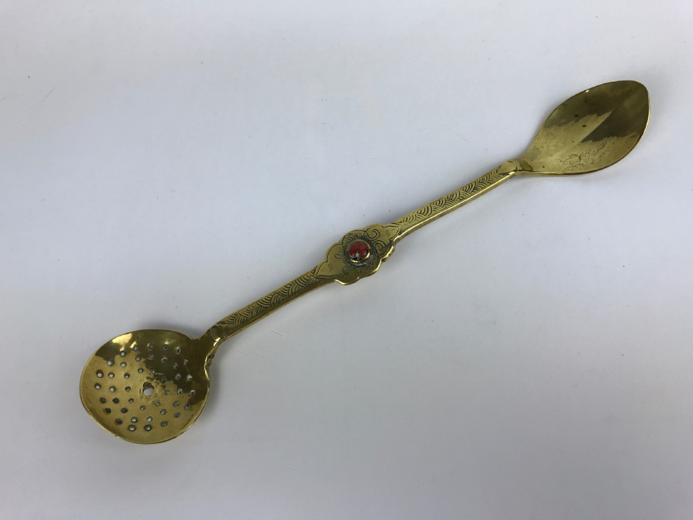 A Coral Mounted Wrought Brass Buddhist Ritual Spoon: Tibet - 18th