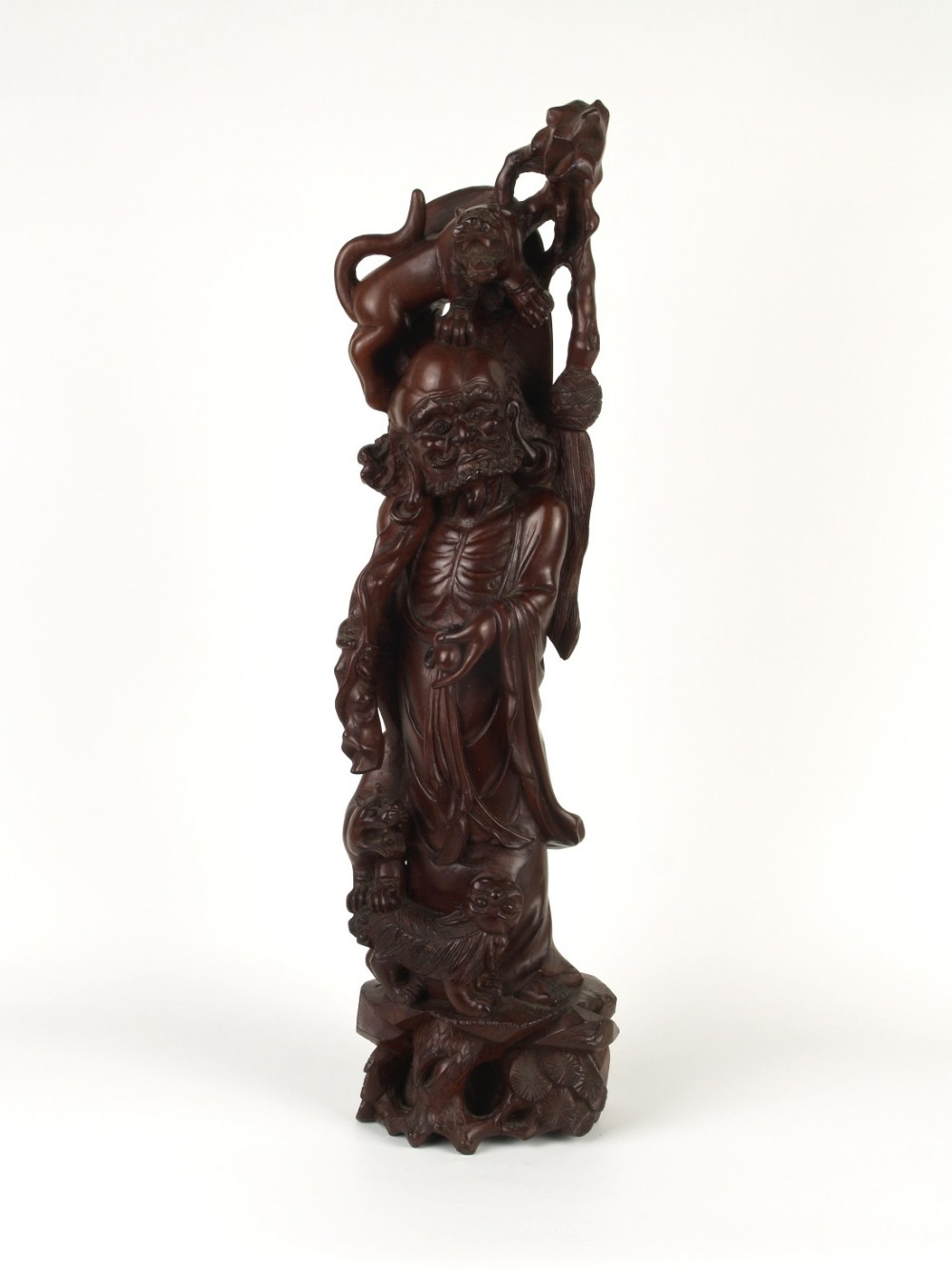 a finely carved japanese late meiji period carved hardwood figure of the immortal li tieguai