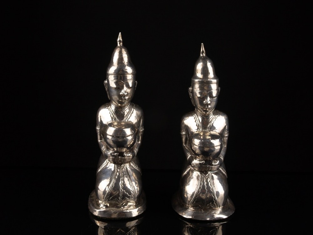 a pair of scarce 19th c burmese silver buddhist monk figures