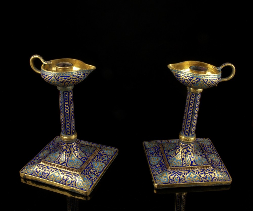 a pair of 19th century kashimiri enamelled gilt copper candlesticks