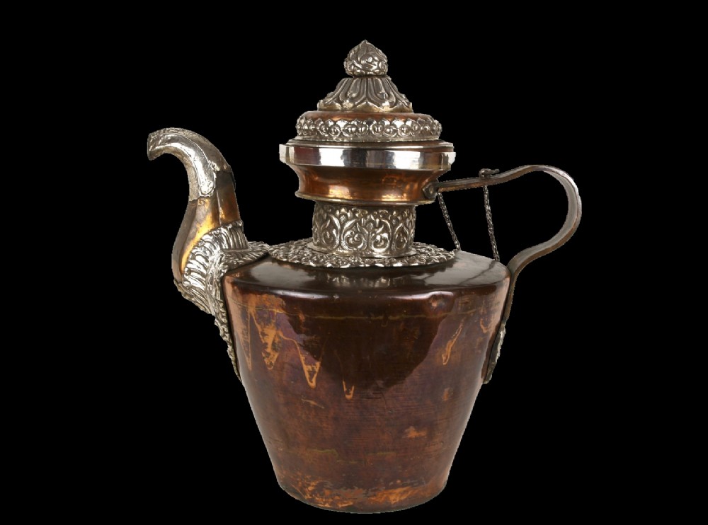 a 19th century tibetan silver mounted copper 'buttertea' pot