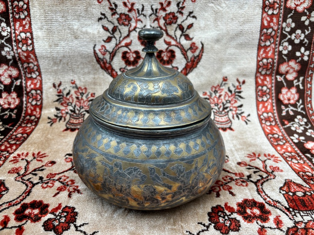 a finely decorated islamic selectively tinned brass bowl cover late 19th century