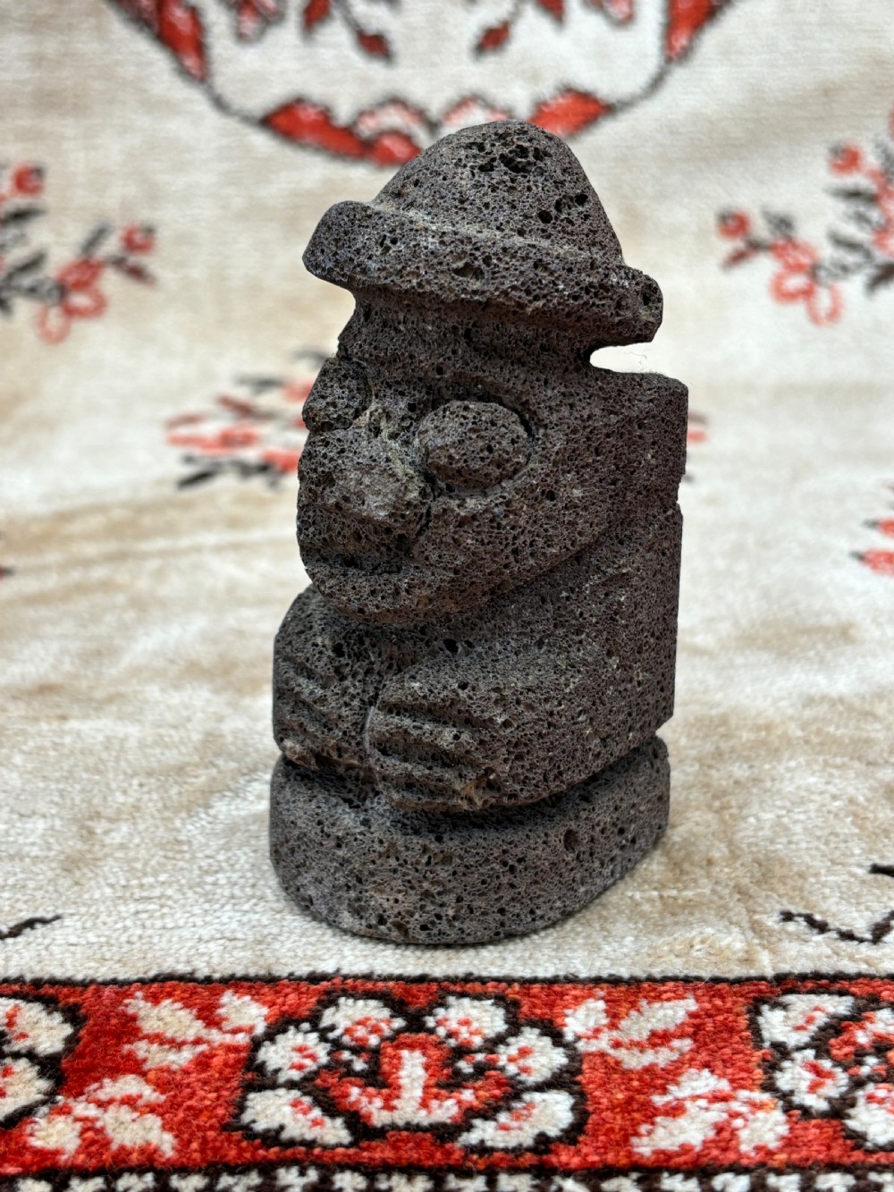 a carved volcanic lava stone ancestor figure jeju island south korea early to mid 20th c