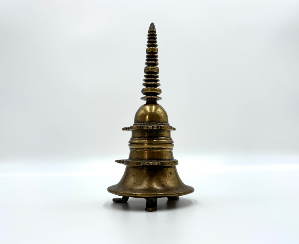 a cast brass buddhist stupa form tripod reliquary vessel india 18th century